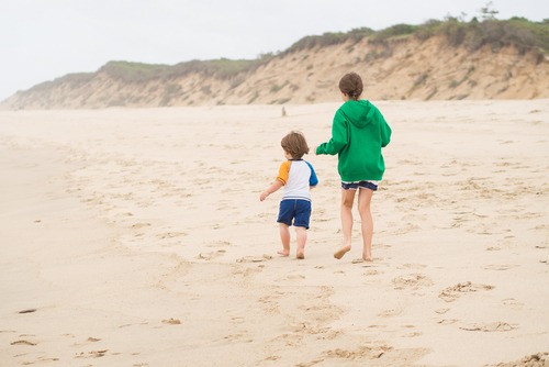kids running on Cape Cod beach